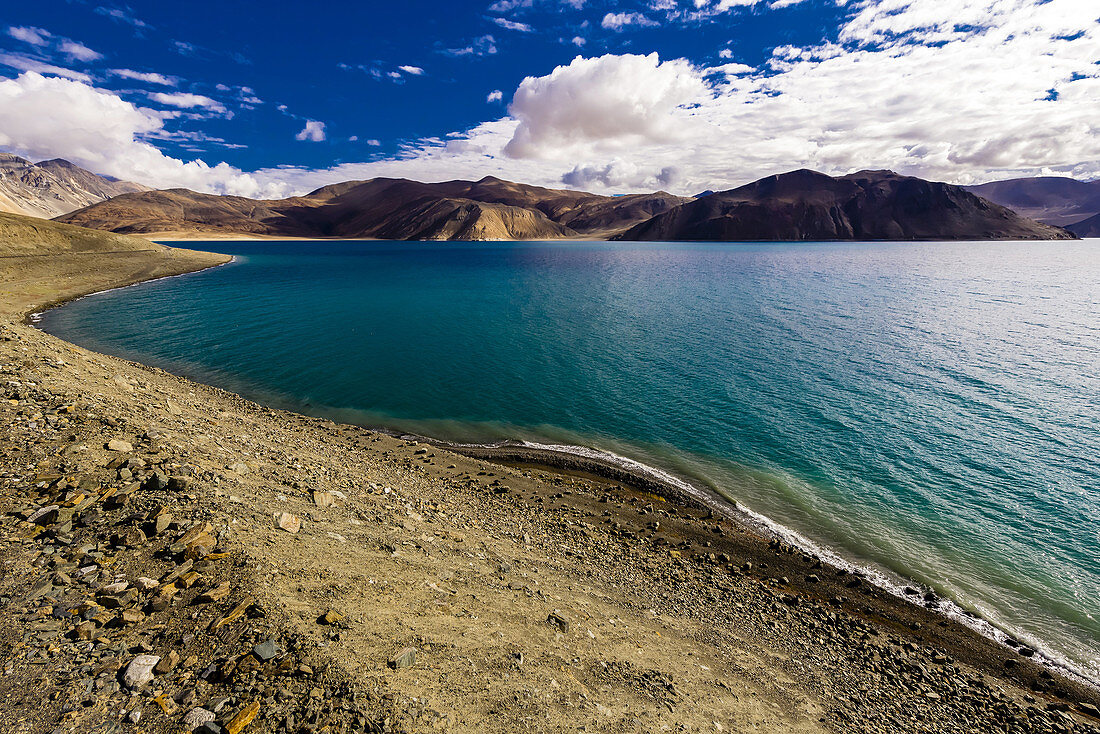 83 mile long Pangong Lake is the highest salt water lake in the world. It sits at 14,000 feet. 30% of the lake is in India and 70% is in China (Tibet). Ladakh, Jammu and Kashmir State, India.