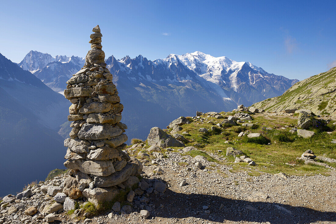 Cairn, at background can be seen the Mont Blanc Peak, Mont Blanc Massif, Alps, Chamonix, France.