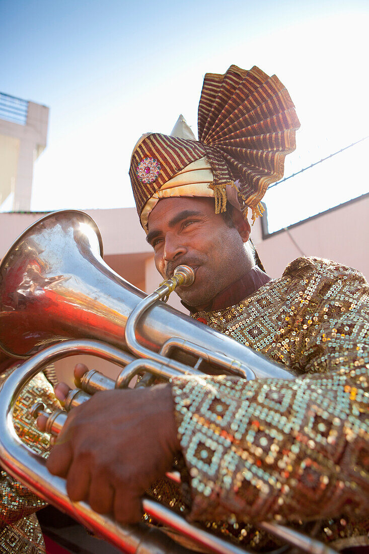 'A Man Playing A Brass Instrument; Ludhiana, Punjab, India'