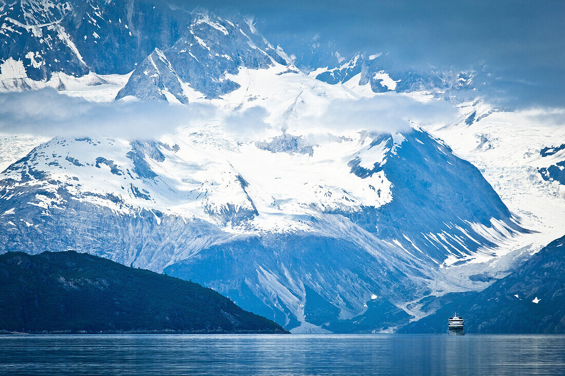 A Small Cruise Ship Sailing Through Tarr Inlet With The Fairweather Range In The Background, Glacier Bay National Park & Preserve, Southeast Alaska, Summer