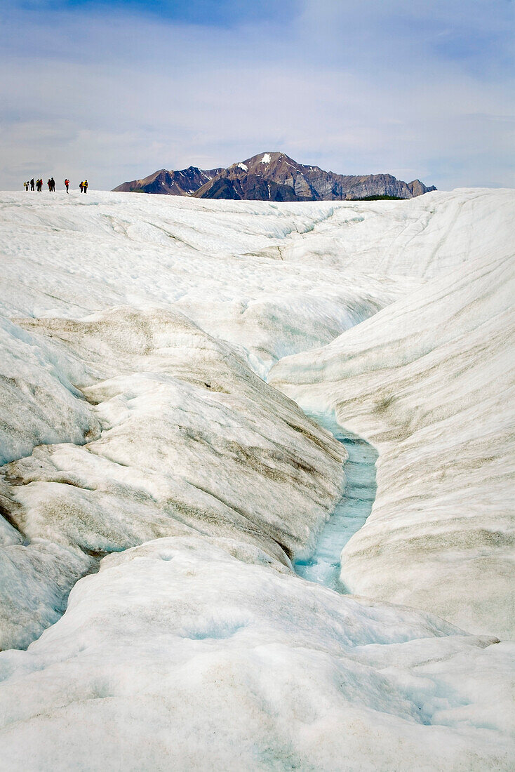 Group Of Hikers On The Root Glacier Near Kennicott In Wrangell-St.Elias National Park, Alaska