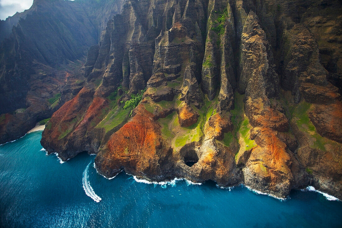 'Aerial view of the rugged coastline along an hawaiian island; Hawaii, United States of America'