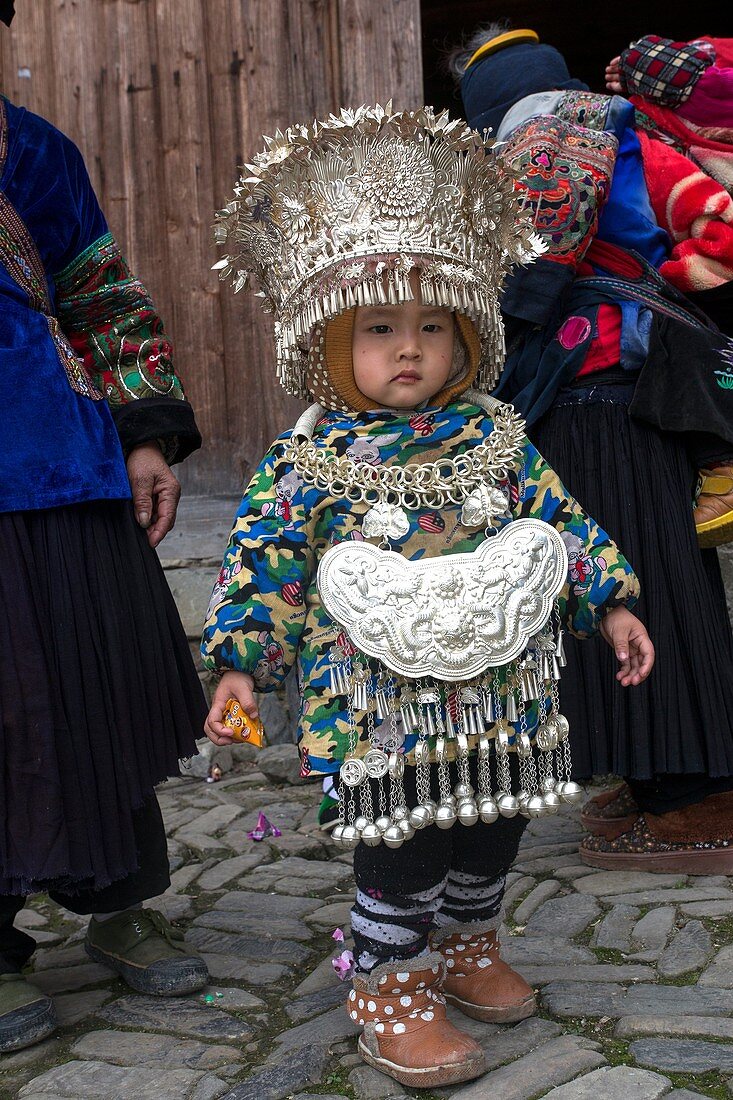 China ,Guizhou province , Langde village , Long Skirt Miao people in traditional dress , child.