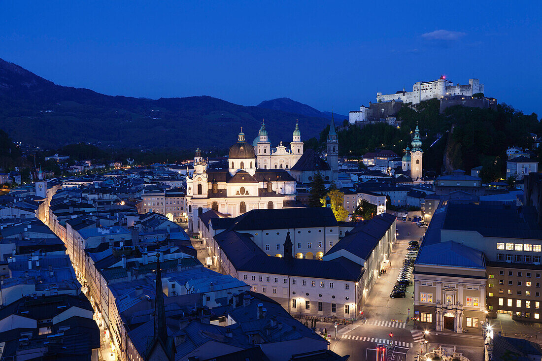 High angle view of the old town with Hohensalzburg Fortress, Dom Cathedral and Kappuzinerkirche Church at dusk, UNESCO World Heritage Site, Salzburg, Salzburger Land, Austria, Europe