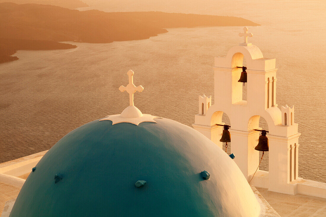 St. Gerasimos Church with blue dome at sunset, Firostefani, Santorini, Cyclades, Aegean Sea, Greek Islands, Greece, Europe