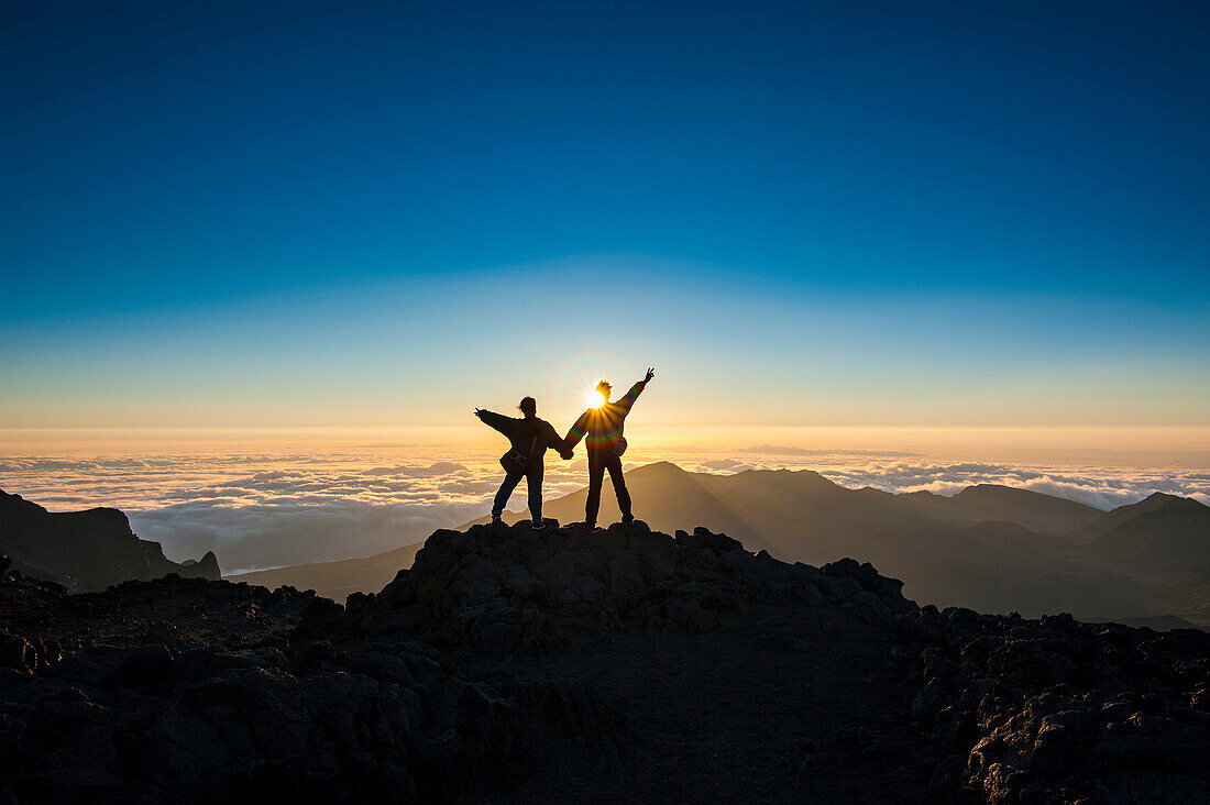 Tourists in backlight waiting for sunset, Haleakala National Park, Maui, Hawaii, United States of America, Pacific