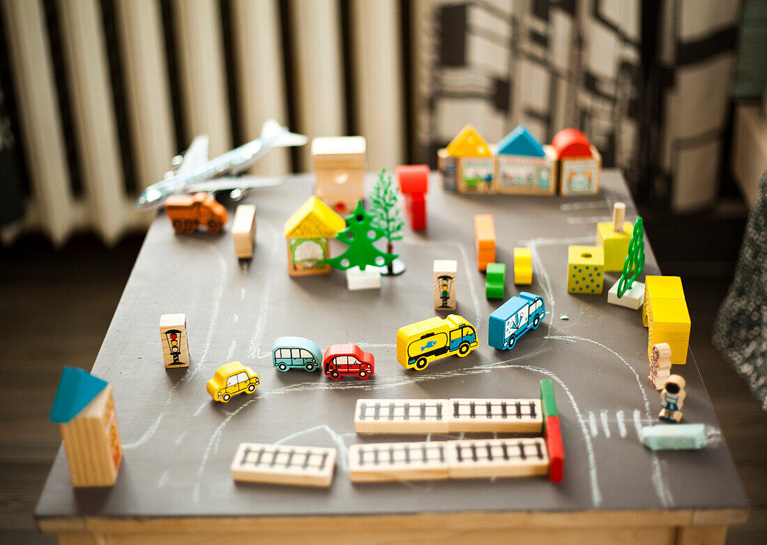 Wooden buildings and car toys on table, Nizhniy Tagil, Sverdlovsk region, Russia