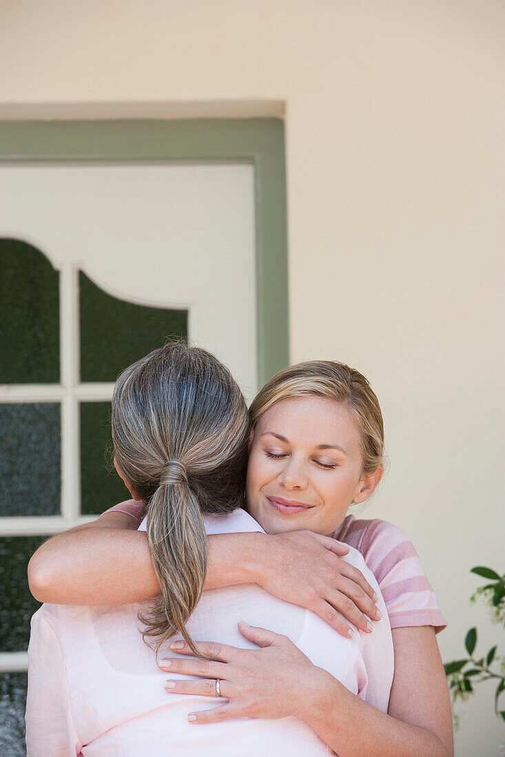 Caucasian mother and daughter hugging, Cape Town, Western Cape, South Africa