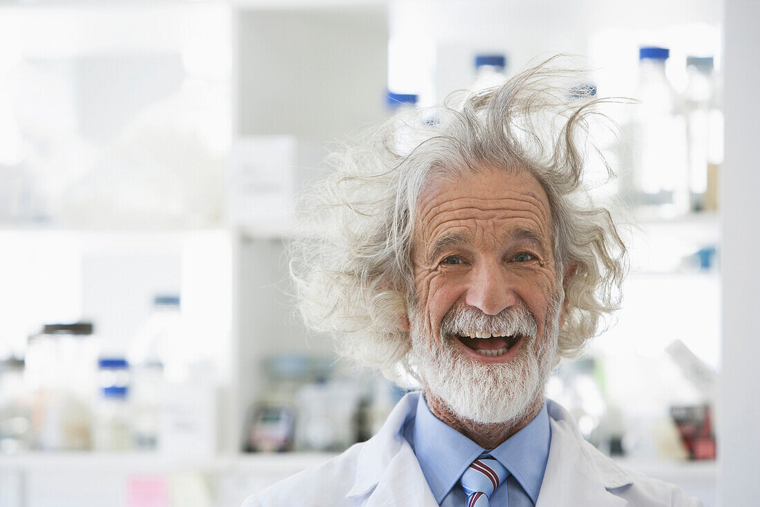 Senior Caucasian scientist with unruly hair in lab, Cape Town, Western Cape, South Africa