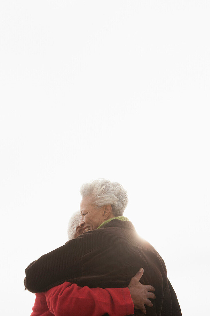 Mixed race Senior couple hugging outdoors, Los Angeles, United States, United States