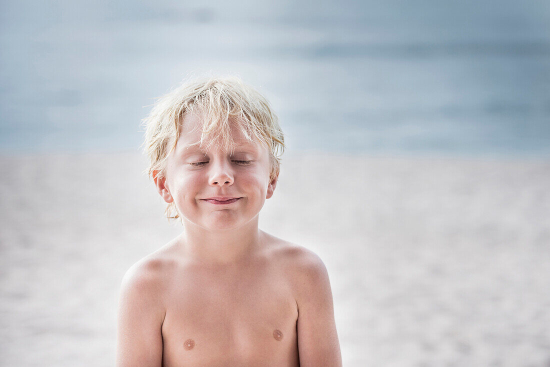 Caucasian boy smiling on beach, Sayulita, Nayarit, Mexico