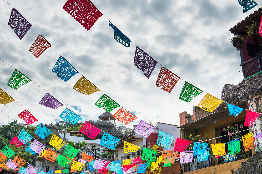 Prayer flags hanging over town streets, Nayarit, Riviera Nayarit, Mexico