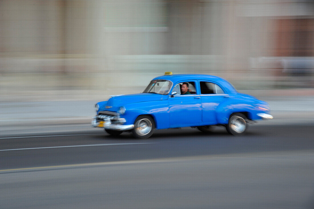 1950s car driving on the Malecon, Havana, Cuba, Caribbean