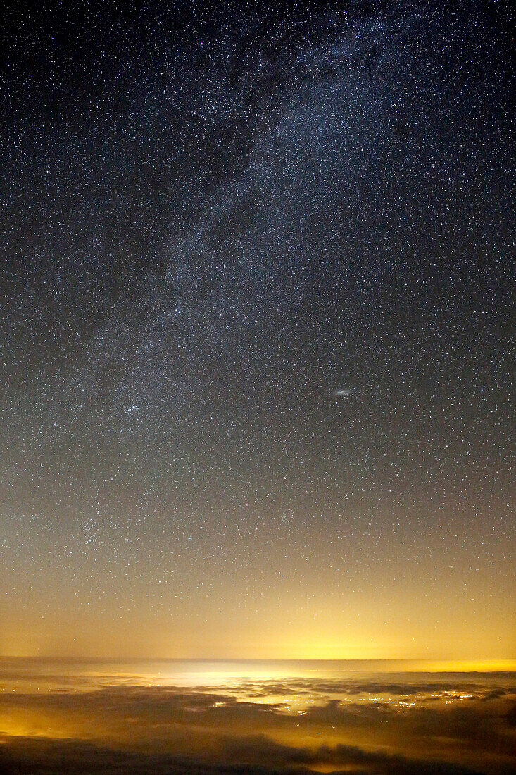 France, Hautes Pyrenees. Pic du Midi Observatory. Milky Way and lights Toulouse.