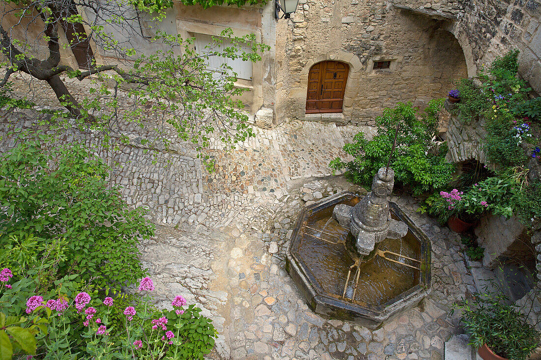 France, Vaucluse (84), Crestet picturesque village with its cobbled streets, stone houses and ornate fountain, situated at near Vaison la Romaine