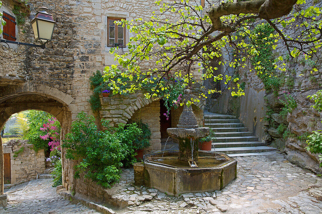 France, Vaucluse (84), Crestet picturesque village with its cobbled streets, stone houses and ornate fountain, situated at near Vaison la Romaine