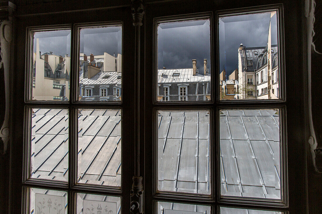 France, Paris, building seen through a window