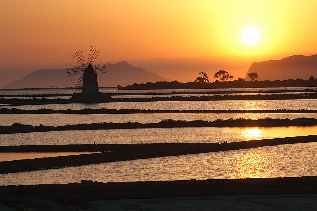 Italy, Sicily, Trapani province, Marsala, salt pond and windmill