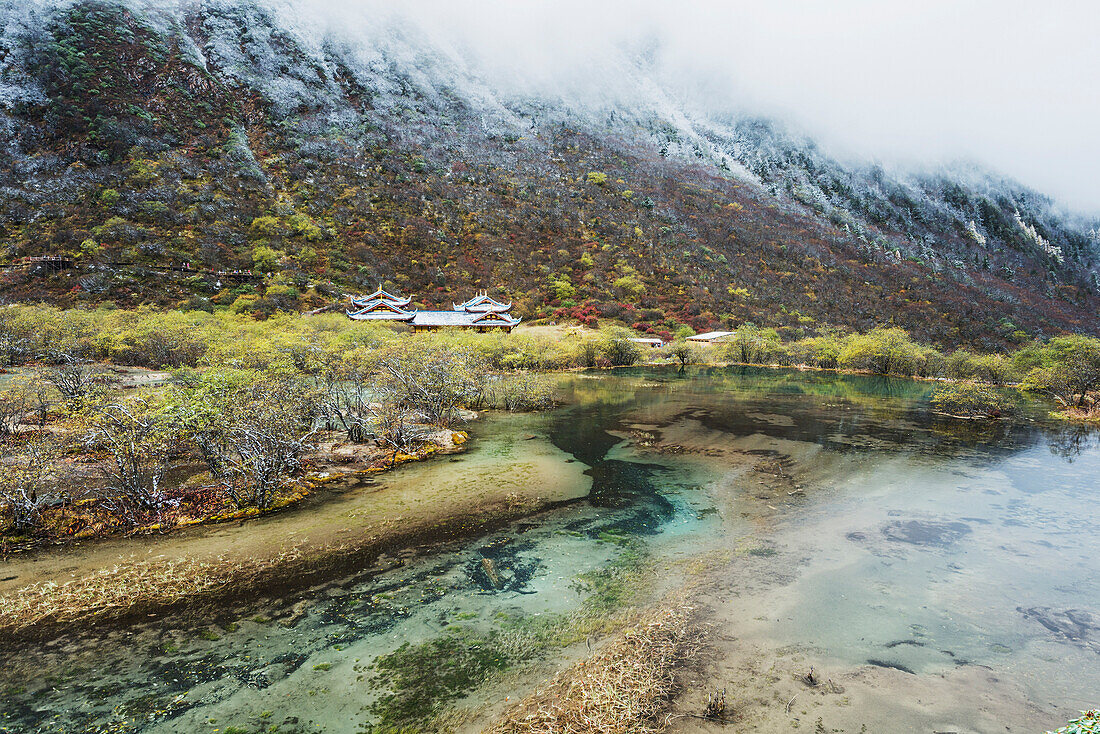 'An Ancient Tibetan Buddhist Temple In A Green Valley With Colorful Ponds And Brooks; Huanglong, Sichuan Province, China'