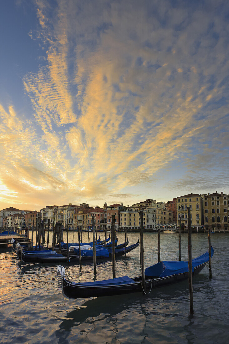 'Gondolas Mooring In The Water At Sunrise; Venice, Italy'