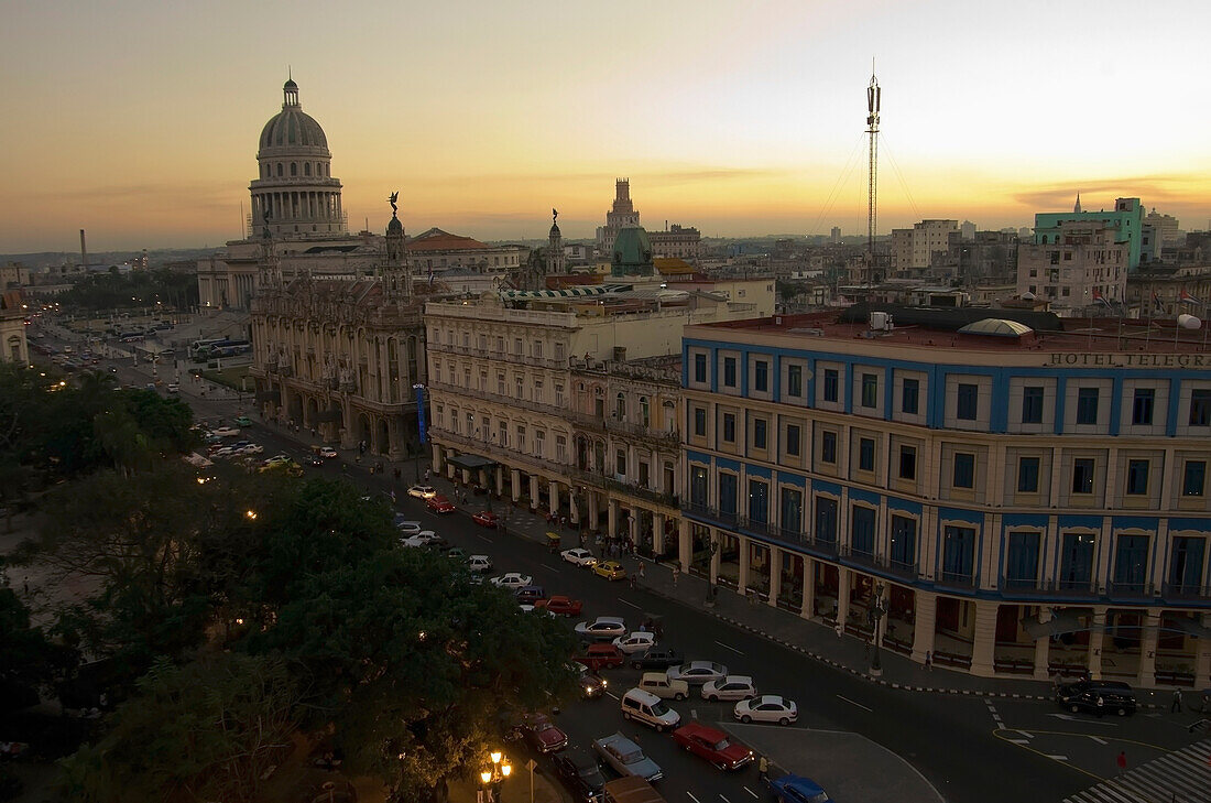 'Capitolio Nacional, Hotels Inglaterra And Telegrafo, Cars On Paseo Del Prado, And Parque Central From Roof Of Hotel Parque Central At Dusk; Havana, Artemisa, Cuba'