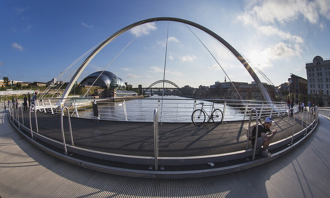 'Millenium Bridge Over River Tyne And Sage Gateshead In The Distance; Newcastle, Tyne And Wear, England'