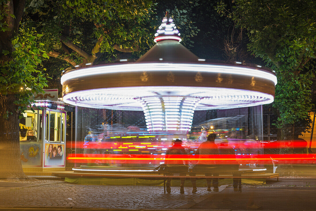 'An Amusement Park Ride Illuminated At Nighttime; Locarno, Ticino, Switzerland'