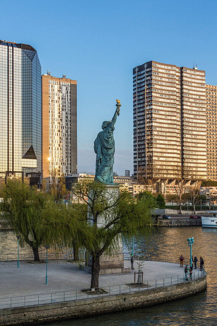 Statue of liberty amidst the high-rises in the beaugrenelle quarter, 15th arrondissement, paris, france