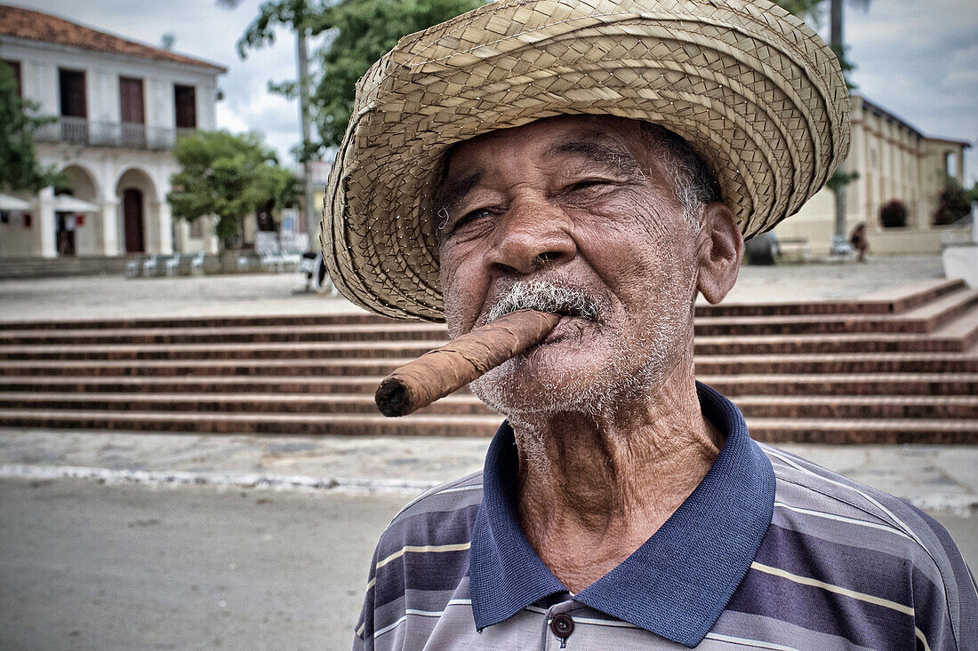 Old man smoking a cuban cohiba (puro) cigar on the street in the town of vinales, vinales valley, listed as a world heritage site by unesco, cuba, the caribbean2