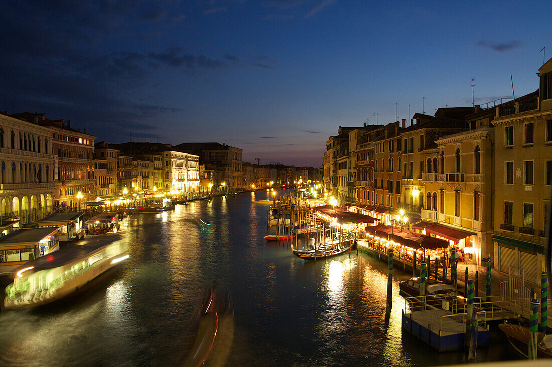 General view of the grand canal and activity on the quays at night, venice, venetia, italy
