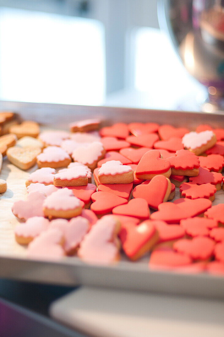 Red and Pink Heart-Shaped Cookies on Baking Sheet