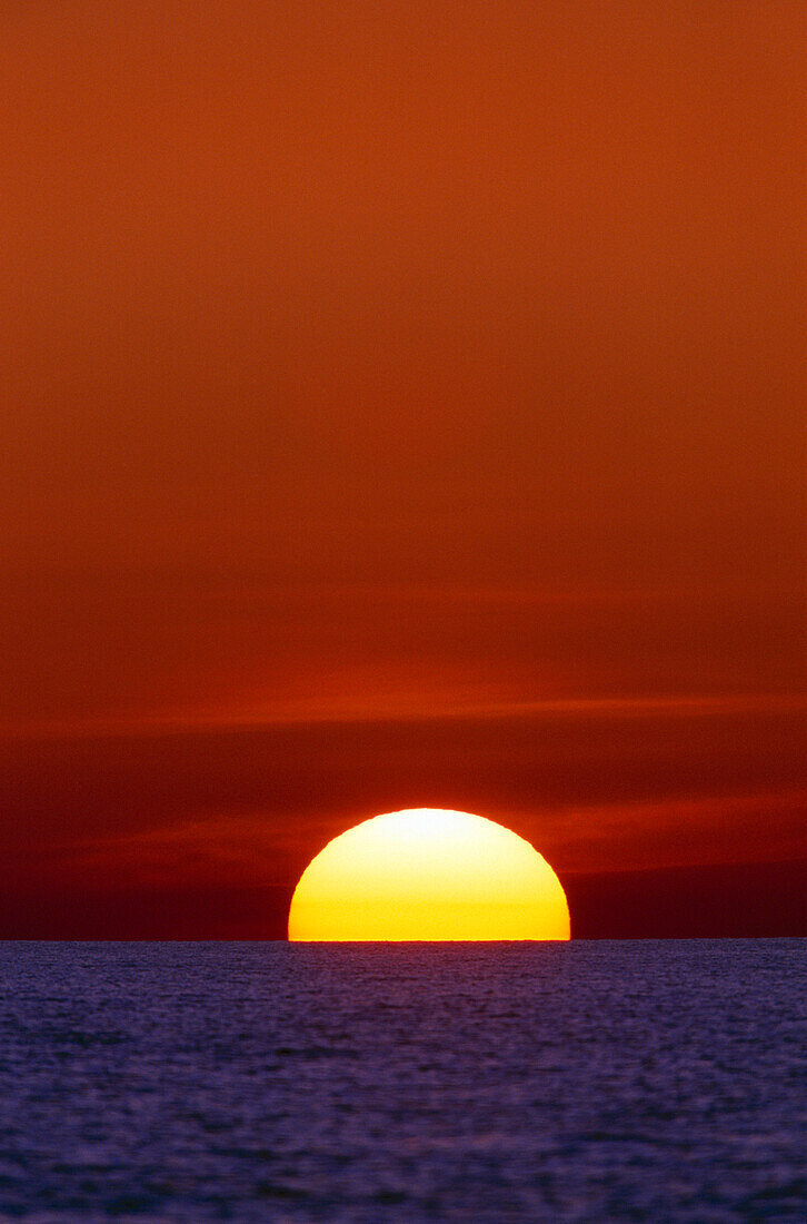 Sun Setting Over The Ocean