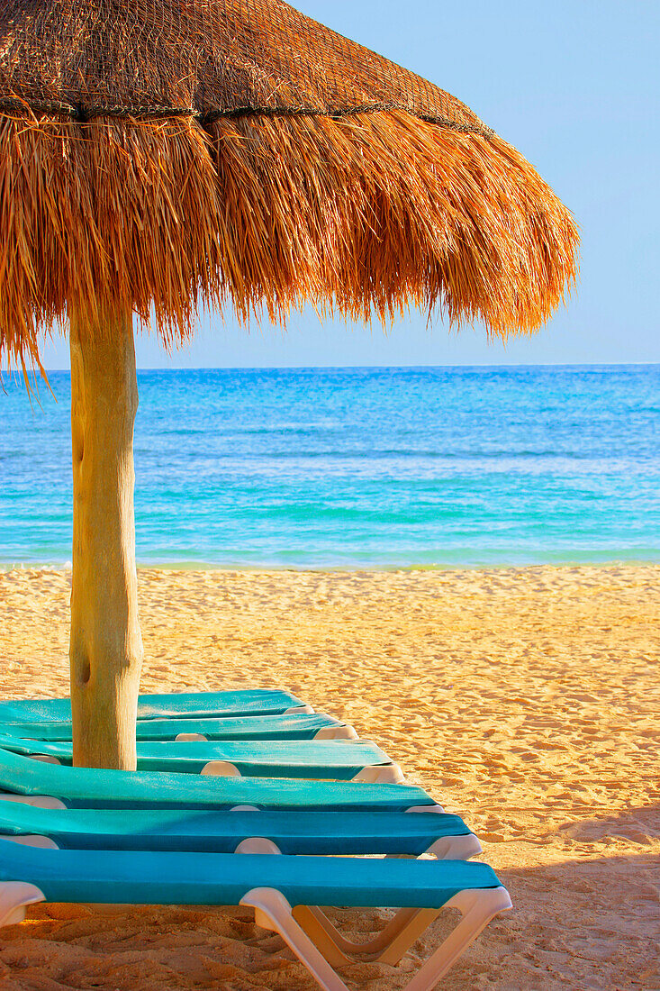 Grass Hut & Loungers On Beach