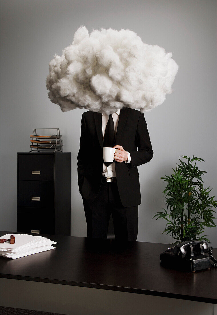 Businessman With Head In The Clouds