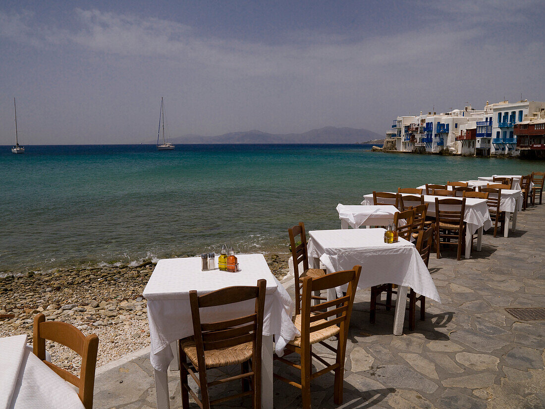 Tables And Chairs With An Ocean View, Greek Islands, Greece
