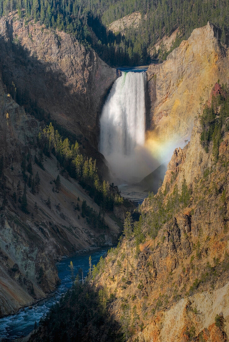 Waterfall From A Mountain And A River Below