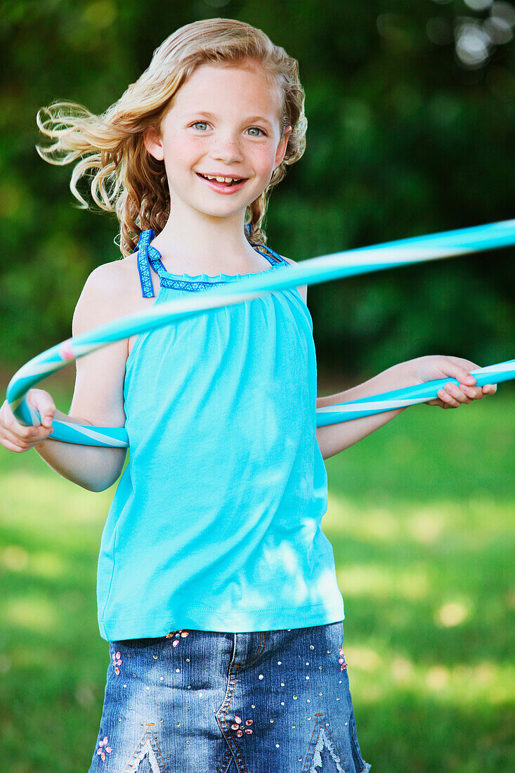 'A Girl Using A Hula Hoop; Oregon, Usa'