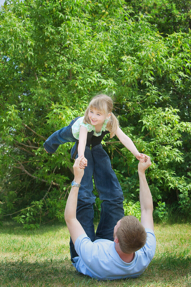 A Father Playing With His Daughter