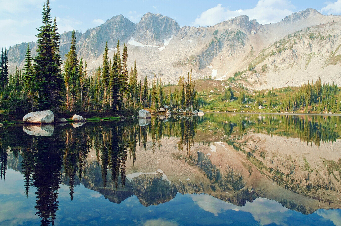 'Eaglecap Wilderness, Oregon, United States Of America; Reflections Of The Trees And Mountains In Blue Lake'