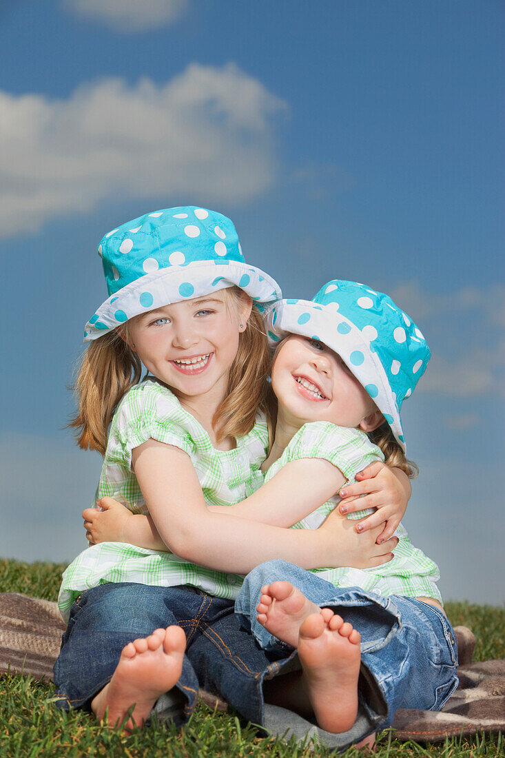 Two Young Girls Hugging