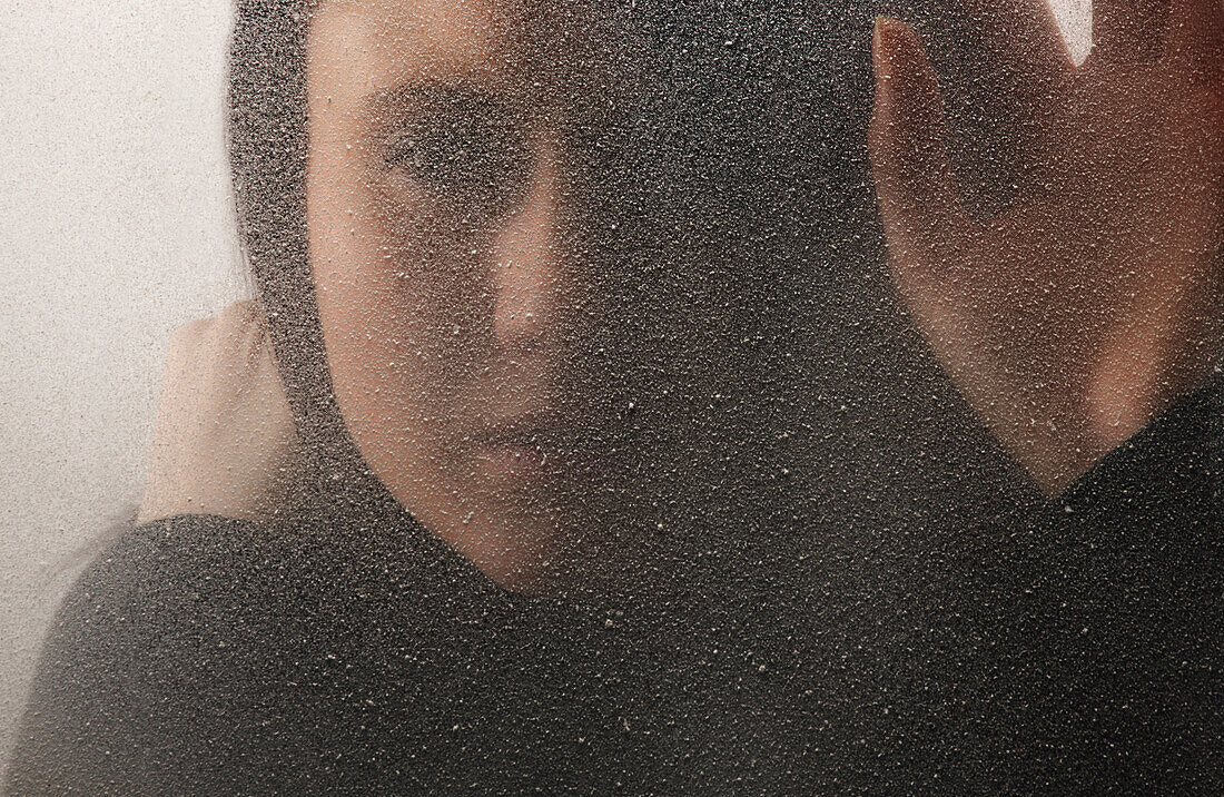 'A Woman Behind A Cold, Frosted Window; Edmonton, Alberta, Canada'