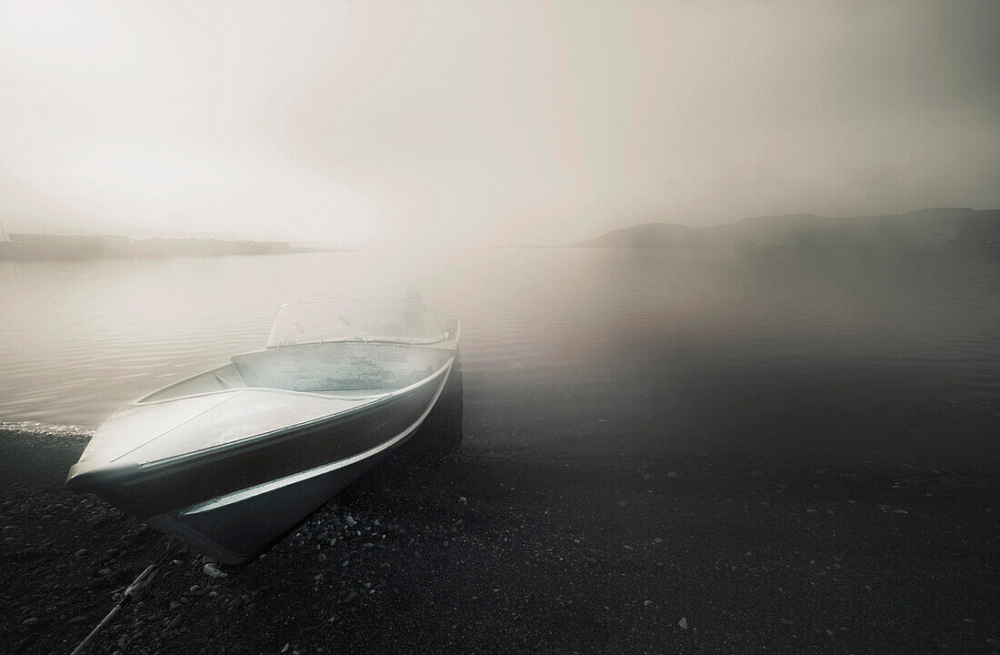 'Northwest Territories, Canada; A Boat On The Shore Of The Arctic Ocean'