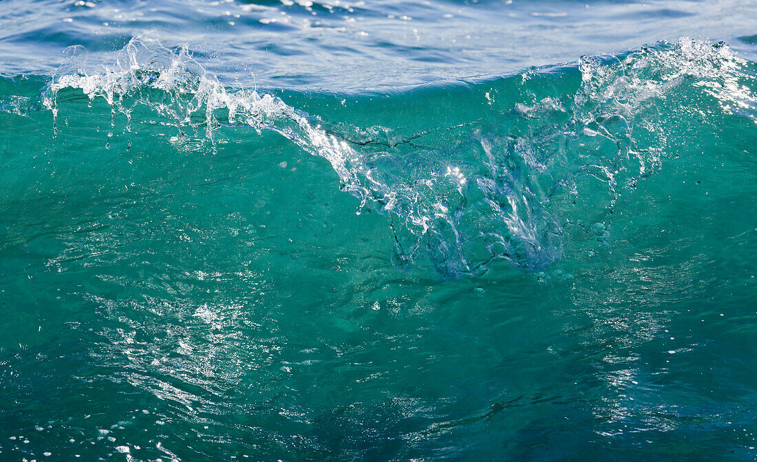 Clear Sea Water As A Wave Begins To Break