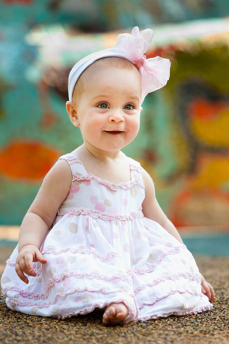 'Baby Girl With A Bow In Her Hair Smiling; Nashville, Tennessee, Usa'