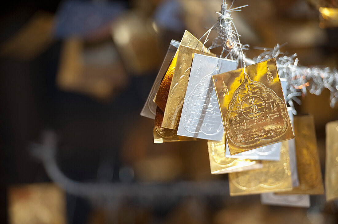 'Gold And Silver Merit Symbols Hanging In Doi Kham Buddhist Temple; Chiang Mai, Thailand'