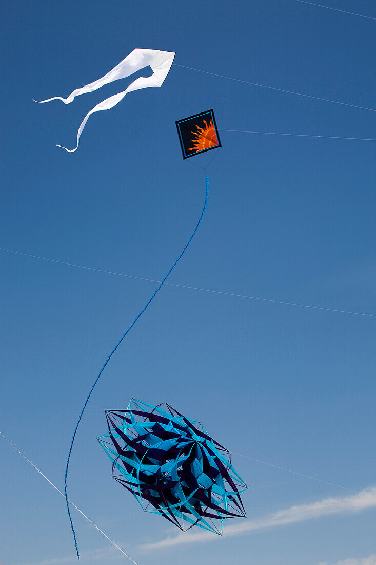 'Decorative Kites Flying In A Blue Sky; Port Colborne, Ontario, Canada'