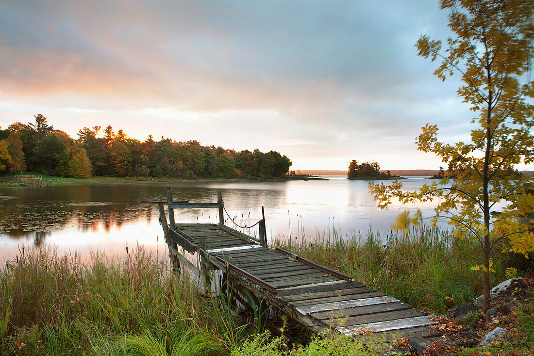 'A Dock On A Lake At Sunrise Near Wawa; Ontario, Canada'