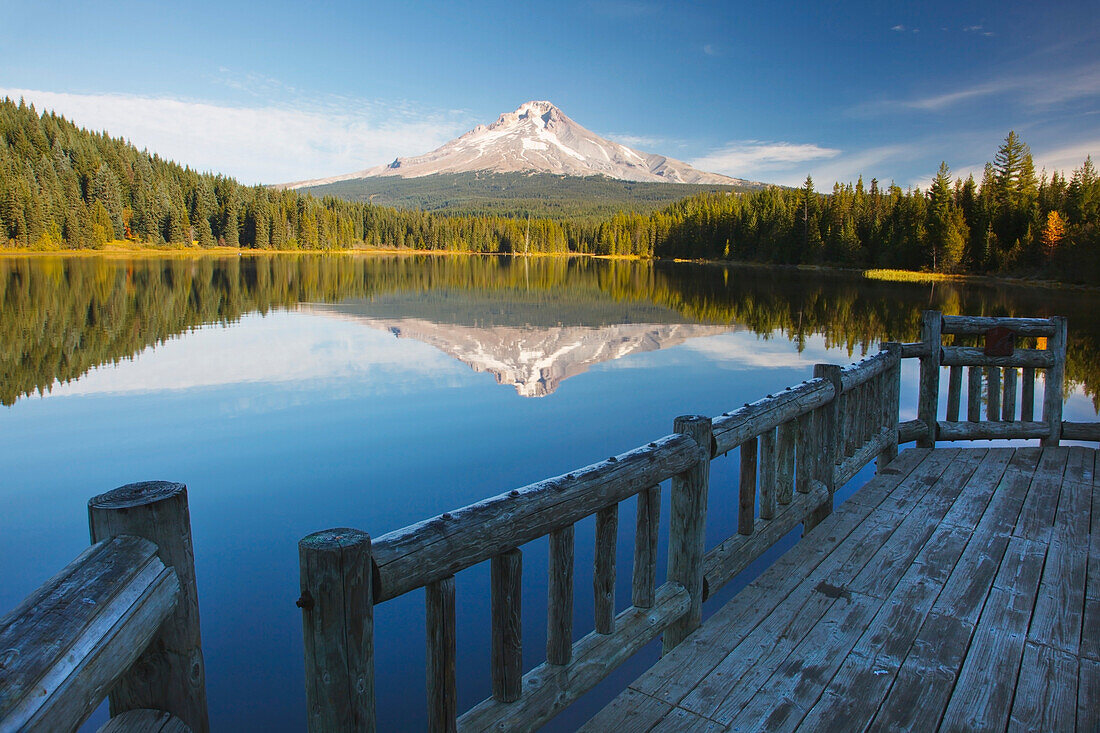 'View Of Mount Hood Reflected In Trillium Lake In Autumn From A Dock; Oregon, United States Of America'