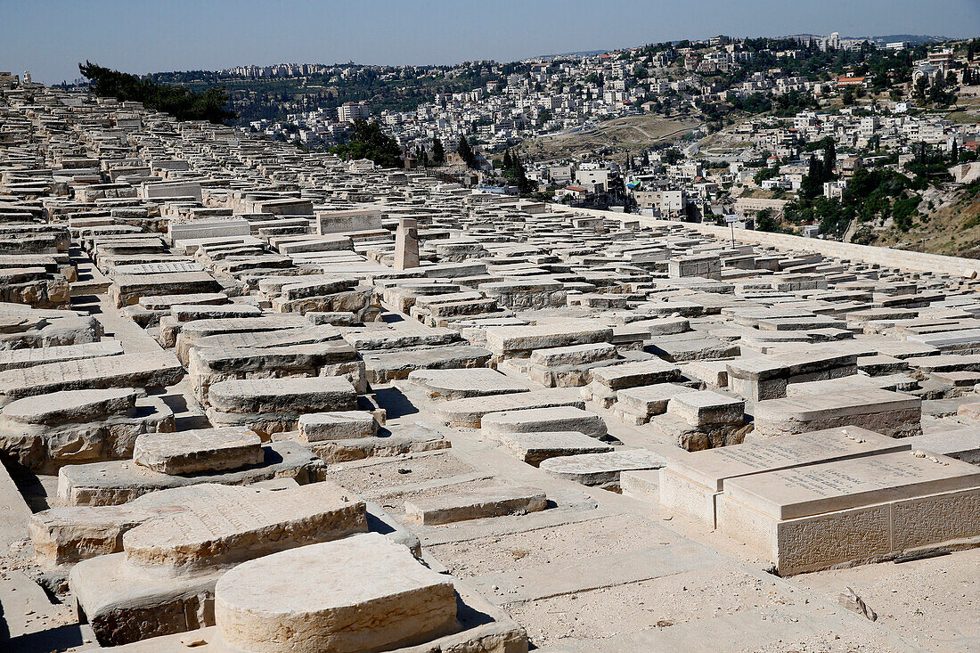 Gravestones (150, 000 graves). Jewish Cemetery on the Mount of Olives with the Dome of the Rock on the Temple Mount in background. Jerusalem. Israel.