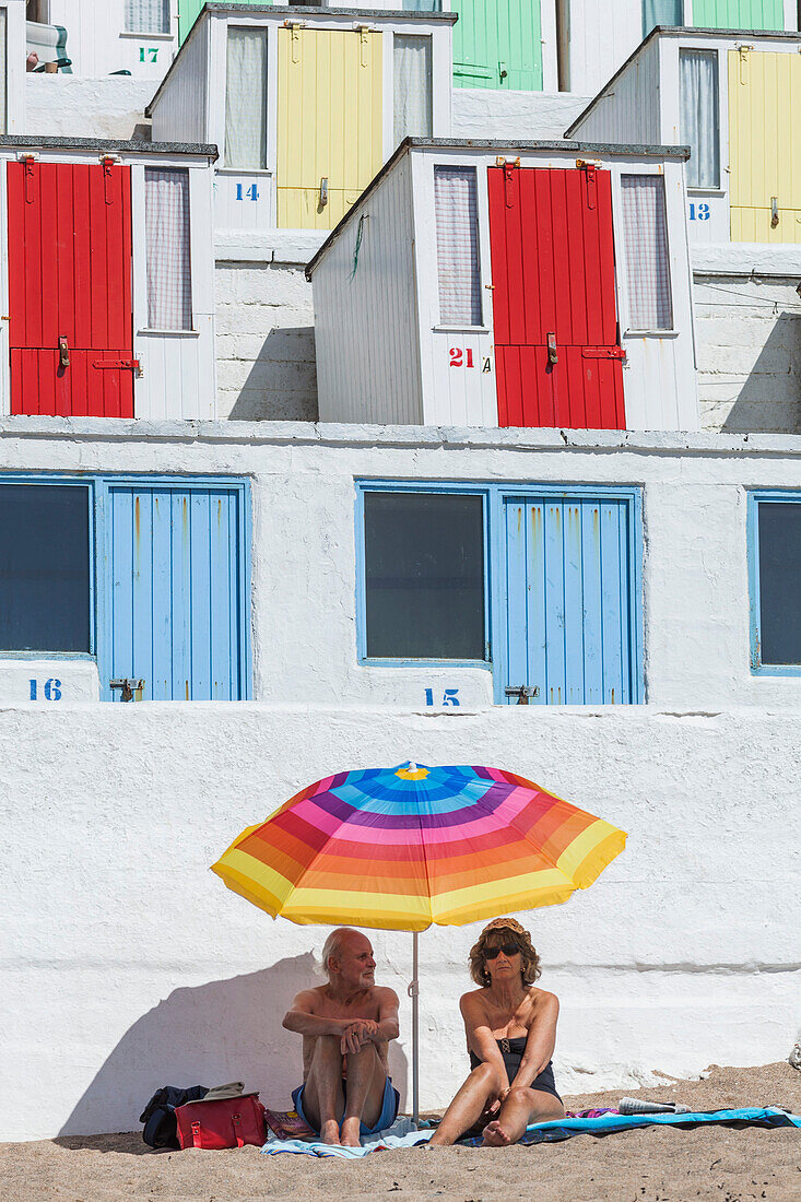 England, Cornwall, Newquay, Tolcarne Beach, Sunbathers and Beach Huts